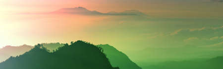 Fabulous light of sun rays at beautiful sunrise in mountains of Java island, Indonesia