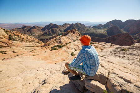 Hike in the Utah mountains. Hiking in unusual natural landscapes. Fantastic forms sandstone formations.の写真素材