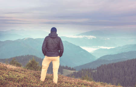 Backpacker in hike in the high mountains