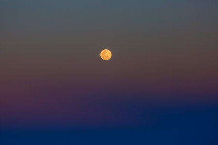 Full Moon in space with dark cloud in night sky.の写真素材