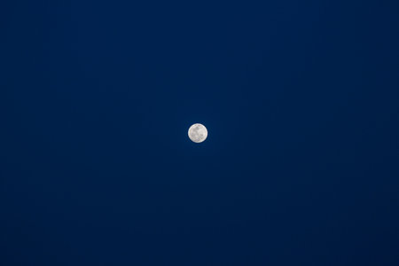 Full Moon in space with dark cloud in night sky.の写真素材