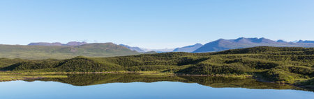 Picturesque Mountains of Alaska in summer. Snow covered massifs, glaciers and rocky peaks.