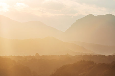 Mountains silhouette at sunrise. Beautiful natural background.の写真素材