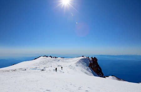 The climb in high snowy mountainsの写真素材