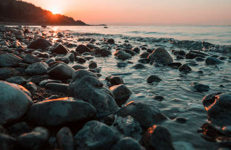 Scenic colorful sunset at the sea coast. Good for wallpaper or background image. Beautiful nature landscapesの写真素材