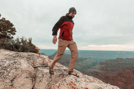 Traveler on cliff mountains over Grand Canyon National Park, Arizona, USA.Inspiring emotion. Travel Lifestyle journey success motivation concept adventure  vacations outdoor concept.の写真素材