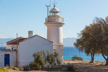 a lighthouse on a picturesque seashoreの写真素材