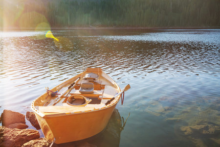 Boat on beautiful lake in Chile mountainsの写真素材