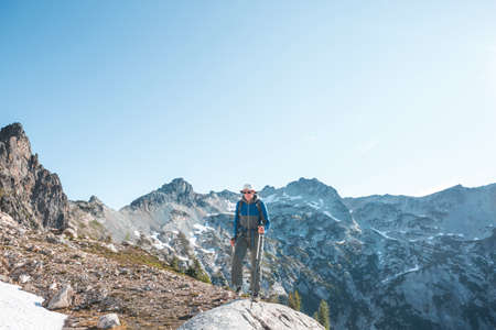 Backpacker in hike in the high mountainsの写真素材