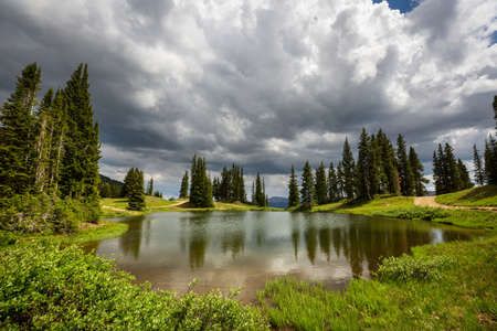 Serenity lake in the mountains in summer season. Beautiful natural landscapes.