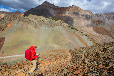 Backpacker in hike in the high mountainsの写真素材