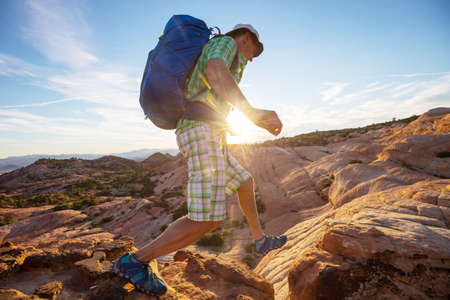Hike in the Utah mountains. Hiking in unusual natural landscapes. Fantastic forms sandstone formations.の写真素材