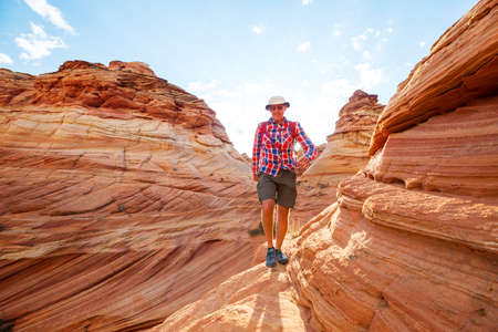 Hike in the Utah mountains. Hiking in unusual natural landscapes. Fantastic forms sandstone formations.の写真素材