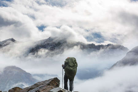 Backpacker in hike in the high mountainsの写真素材