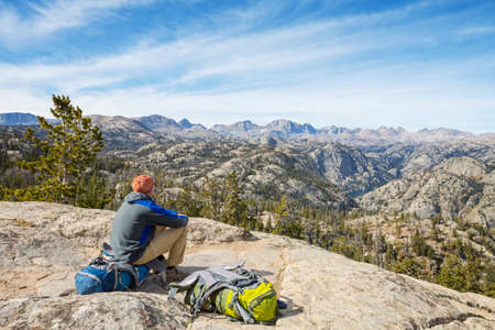 Man in a hike in the summer mountains. Beautiful natural landscapes.の写真素材