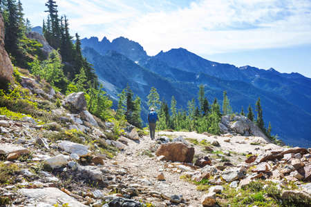 Backpacker in hike in the high mountainsの写真素材
