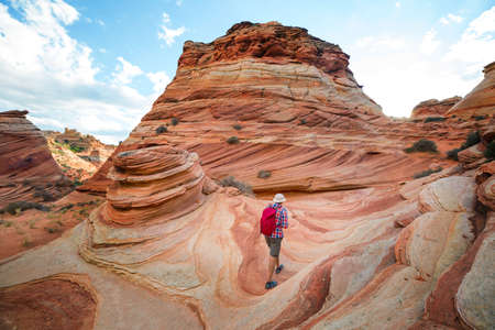 Hike in the Utah mountains. Hiking in unusual natural landscapes. Fantastic forms sandstone formations.の写真素材