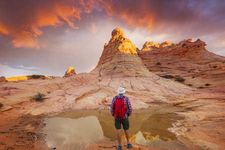 Hike in the Utah mountains. Hiking in unusual natural landscapes. Fantastic forms sandstone formations.の写真素材