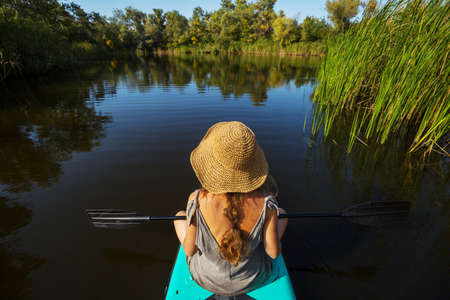 SUP Inflatable paddle board on the summer river at sunriseの写真素材