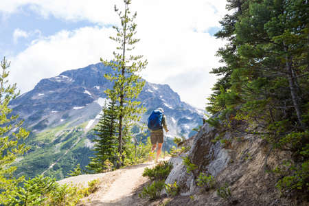 Backpacker in hike in the high mountainsの写真素材