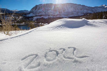 Date 2022 in snow and the symbol of the New Yearの写真素材