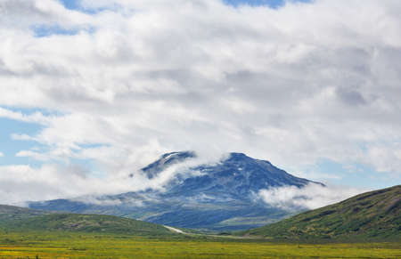 Picturesque Mountains of Alaska in summer. Snow covered massifs, glaciers and rocky peaks. Beautiful natural background.の写真素材
