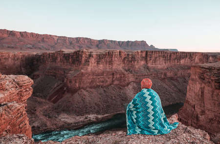 Man on the mountains cliff. Hiking scene.の写真素材