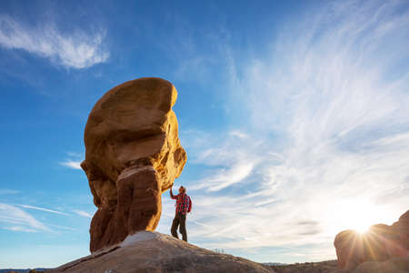 Hike in the Utah mountains. Hiking in unusual natural landscapes. Fantastic forms sandstone formations.の写真素材