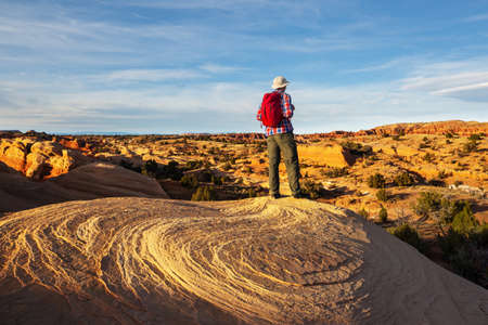 Hike in the Utah mountains. Hiking in unusual natural landscapes. Fantastic forms sandstone formations.の写真素材