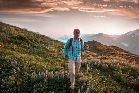 Hiking man in Canadian mountains. Hike is the popular recreation activity in North America. There are a lot of picturesque trails.の写真素材