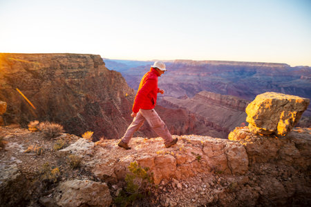 Traveler on cliff mountains over Grand Canyon National Park, Arizona, USA.Inspiring emotion. Travel Lifestyle journey success motivation concept adventure  vacations outdoor concept.の写真素材
