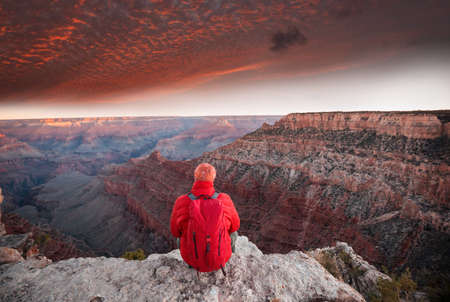 Traveler on cliff mountains over Grand Canyon National Park, Arizona, USA.Inspiring emotion. Travel Lifestyle journey success motivation concept adventure  vacations outdoor concept.の写真素材