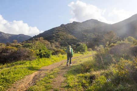 Man in a hike in the summer mountains. Beautiful natural landscapes.の写真素材