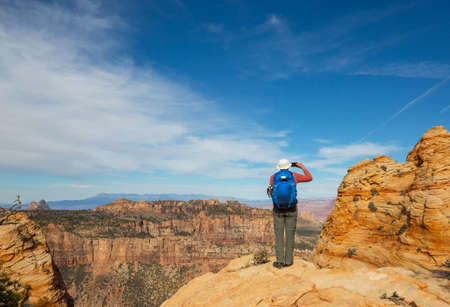 Hike in the Utah mountains. Hiking in unusual natural landscapes. Fantastic forms sandstone formations.の写真素材