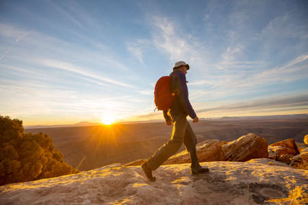 Hike in the Utah mountains. Hiking in unusual natural landscapes. Fantastic forms sandstone formations.の写真素材