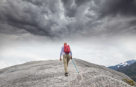 Backpacker in hike in the high mountainsの写真素材
