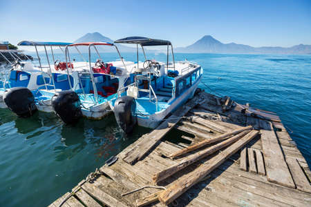 Beautiful lake Atitlan and volcanos in the highlands of Guatemala, Central Americaの写真素材
