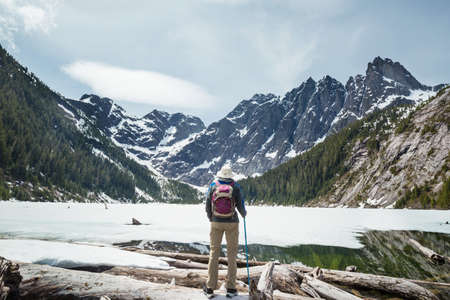 Hiking man in Canadian mountains. Hike is the popular recreation activity in North America. There...