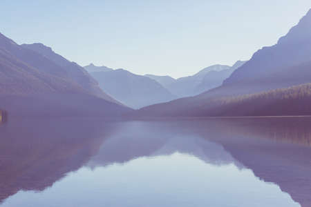 Beautiful Bowman lake with reflection of the spectacular mountains in Glacier National Park, Montana, USA.の写真素材
