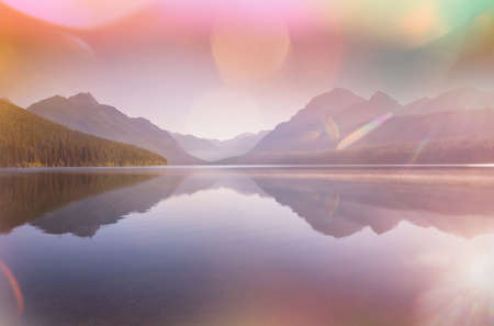 Beautiful Bowman lake with reflection of the spectacular mountains in Glacier National Park, Montana, USA.の写真素材