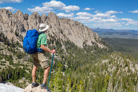hiker in mountains on beautiful rock background