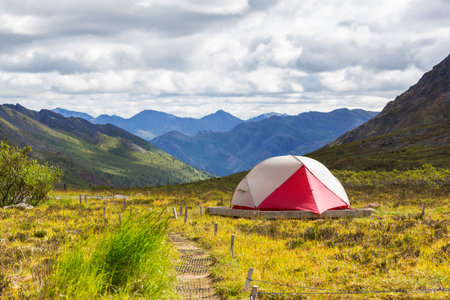 Tent in the mountains in polar tundra, Tombstone Territorial Park, Yukon, Canada.の写真素材