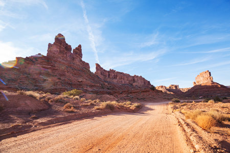 Valley of the Gods rock formation with Monument Valley at sunriseの写真素材