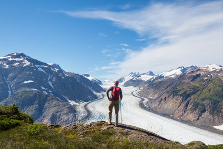 Hiking man in Canadian mountains. Hike is the popular recreation activity in North America. There...