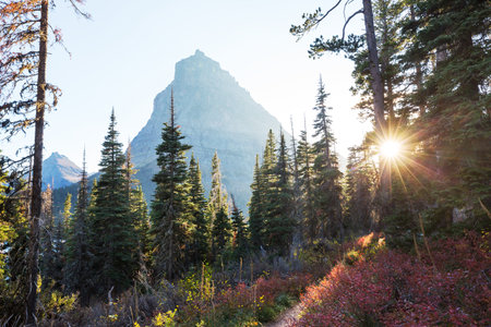 Picturesque rocky peaks of the Glacier National Park, Montana, USA. Autumn season. Beautiful natural...