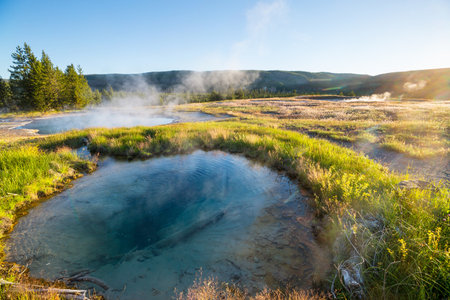 Inspiring natural background. Pools and  geysers  fields  in Yellowstone National Park, USA.の写真素材