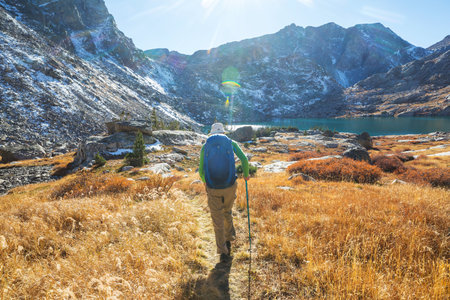 Hike in the autumn mountains. Fall season theme.