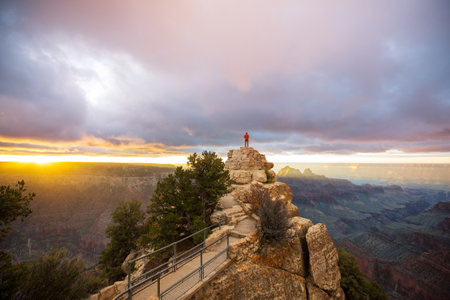 Traveler on cliff mountains over Grand Canyon National Park, Arizona, USA.Inspiring emotion. Travel Lifestyle journey success motivation concept adventure  vacations outdoor concept.の写真素材