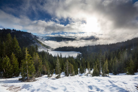 Snow covered mountains in winter seasonの写真素材