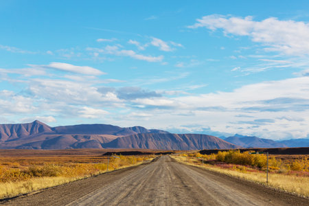 Endless Dempster Highway near the arctic circle, remote gravel road leading from Dawson City to Inuvik, Canadaの写真素材